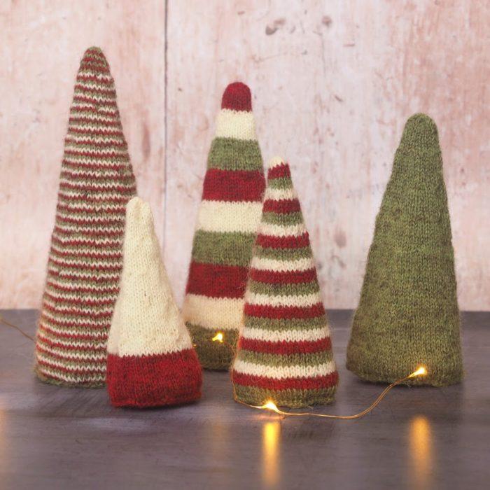 5 conical knitted trees in red, cream and green