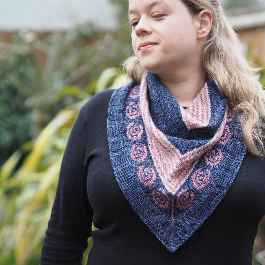 Navy, pink and cream bandana cowl with pink roses worn by a blonde woman