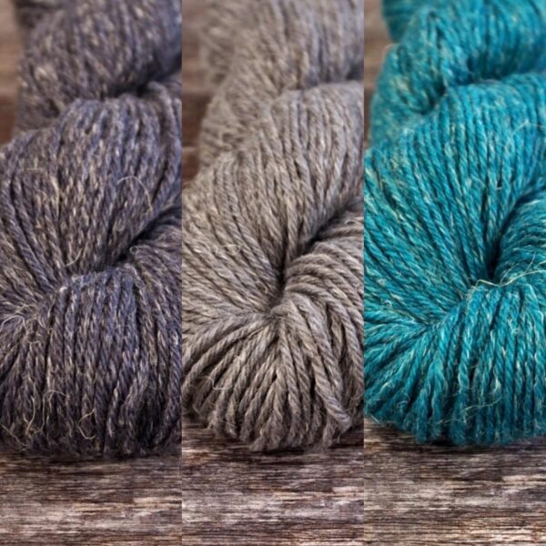 Teal party yarn selection in dark and mid grey and a teal blue
