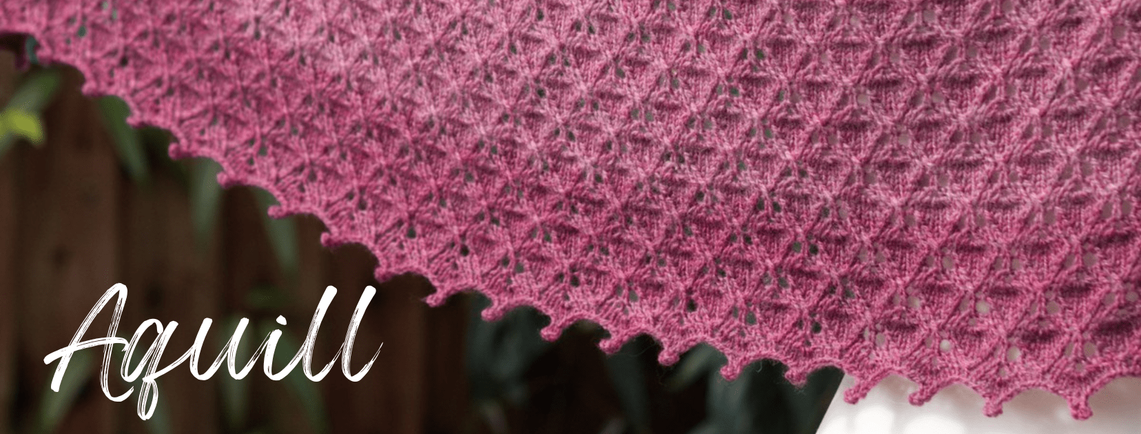 pink crescent shawl with a textured allover lace pattern