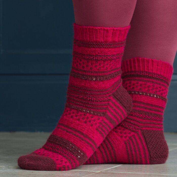 red and burgundy socks with texture and dot fabric