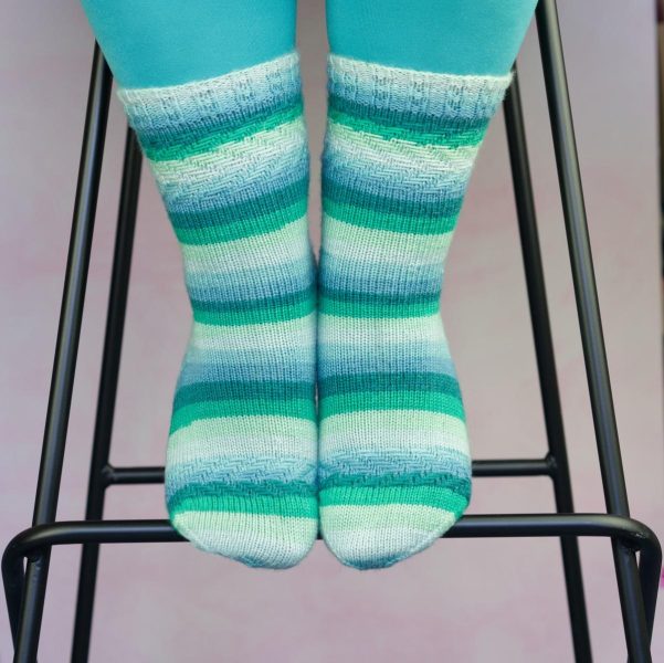 sea green striped socks with woven texutre at cuff, heel and ball of foot