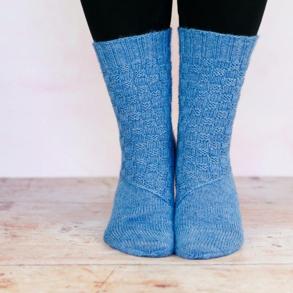 mid blue texture sock with diagonal band across arch
